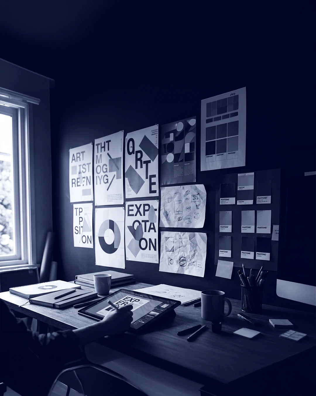 Graphic design studio — poster type explorations, layout grids and Pantone swatches
